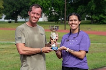 U.S. Airmen pose with a trophy after the Murph Challenge