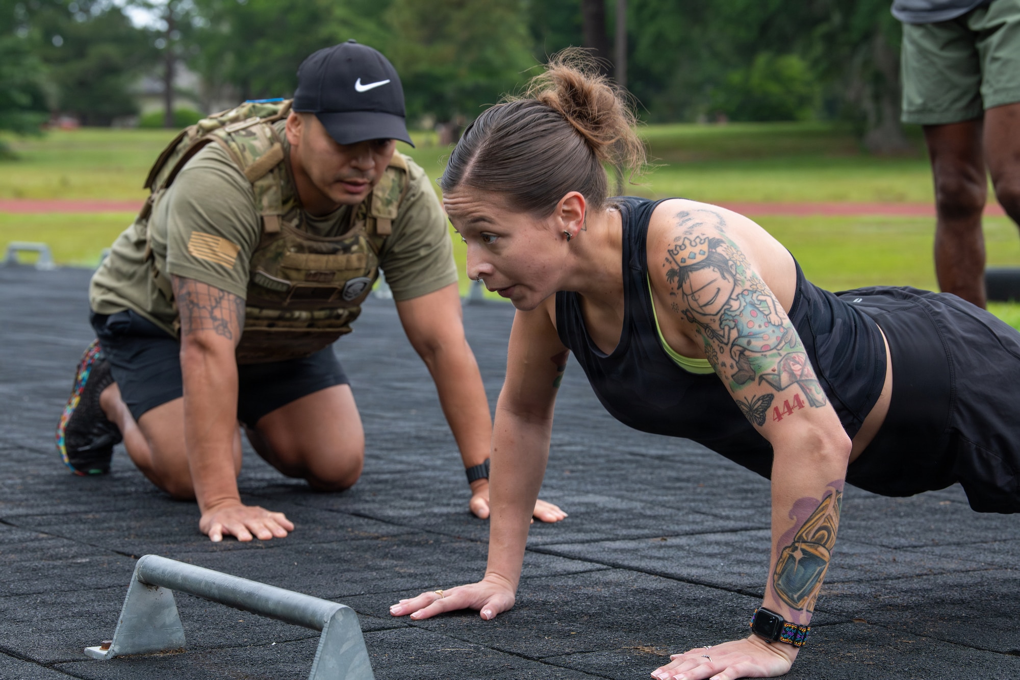 U.S. Airmen perform push-ups.