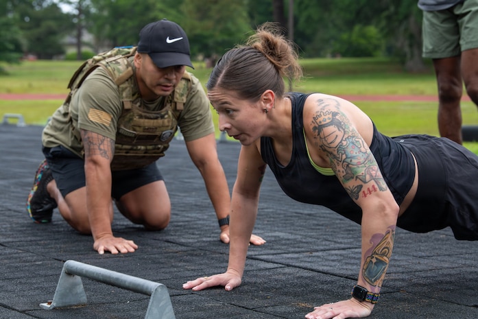 U.S. Airmen perform push-ups.