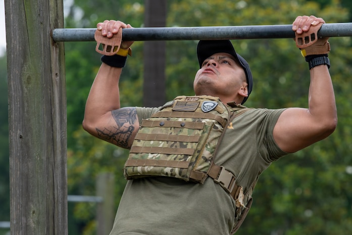 Airman performs a pull-up.