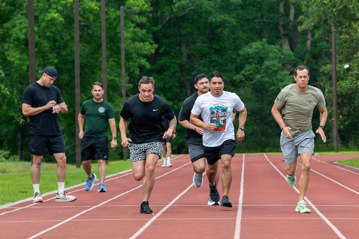 U.S. Airmen running on the base fitness track.