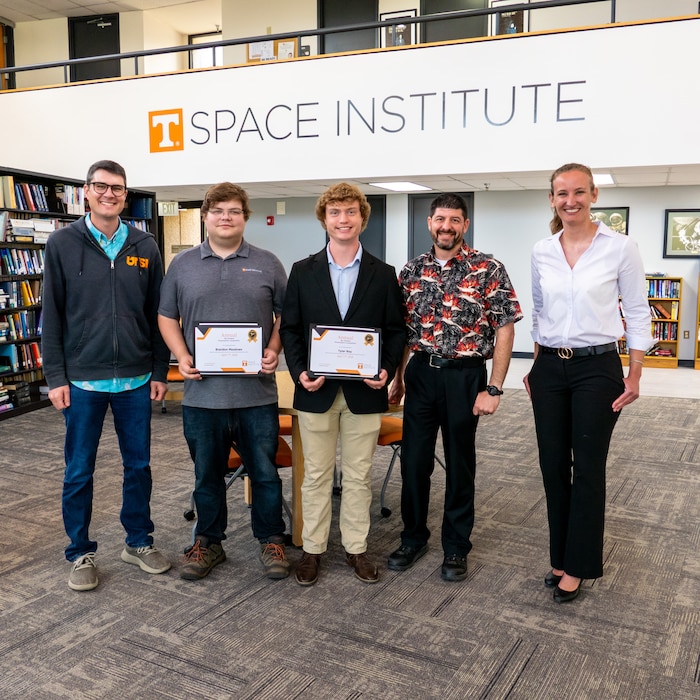 Graduate students at the University of Tennessee Space Institute (UTSI) presented their research during the UTSI 9th Annual Wu Student Presentation Competition, April 17, 2026. Six competitors showcased work in mechanical, aerospace and biomedical engineering. From left is judge Rylan Cox, second place winner Tyler Roy, first place winner Brandon Meadows, judge James Masters and Garbielle Till, who also served as judge. Cox, Masters and Till are all employees at Arnold Air Force Base, Tenn., headquarters of Arnold Engineering Development Complex. (Courtesy Photo from the University of Tennessee Space Institute)