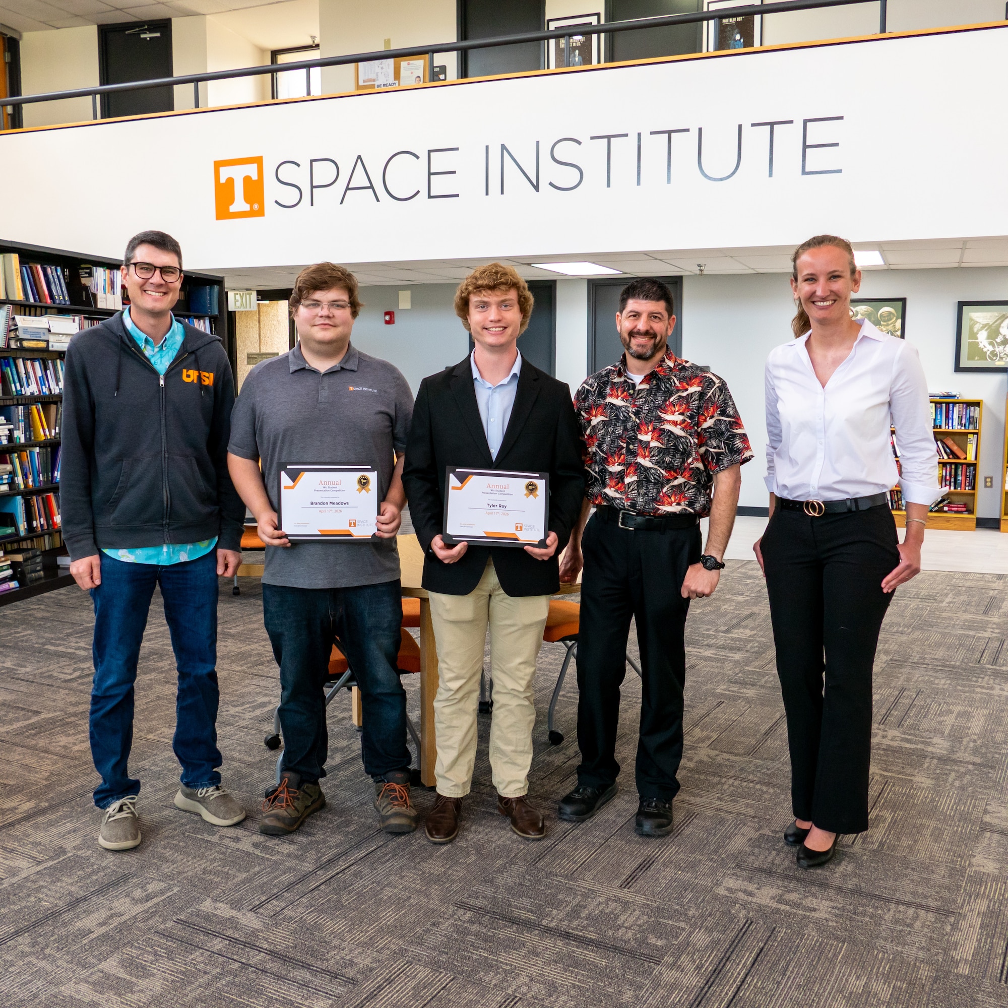 Graduate students at the University of Tennessee Space Institute (UTSI) presented their research during the UTSI 9th Annual Wu Student Presentation Competition, April 17, 2026. Six competitors showcased work in mechanical, aerospace and biomedical engineering. From left is judge Rylan Cox, second place winner Tyler Roy, first place winner Brandon Meadows, judge James Masters and Garbielle Till, who also served as judge. Cox, Masters and Till are all employees at Arnold Air Force Base, Tenn., headquarters of Arnold Engineering Development Complex. (Courtesy Photo from the University of Tennessee Space Institute)