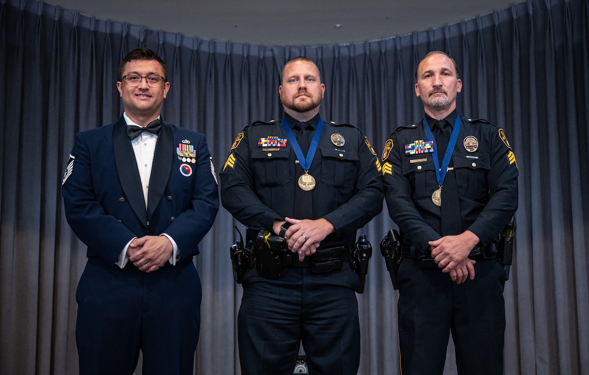 From left, U.S. Air Force Master Sgt. Ryan McConnell 42d Force Support Squadron Airman Leadership command, and Sgts. Adam Wright and Robert Hubbard, both with the Montgomery Police Department, pose for a photo during an ALS graduation at Maxwell Air Force Base, Alabama, May 21, 2026.