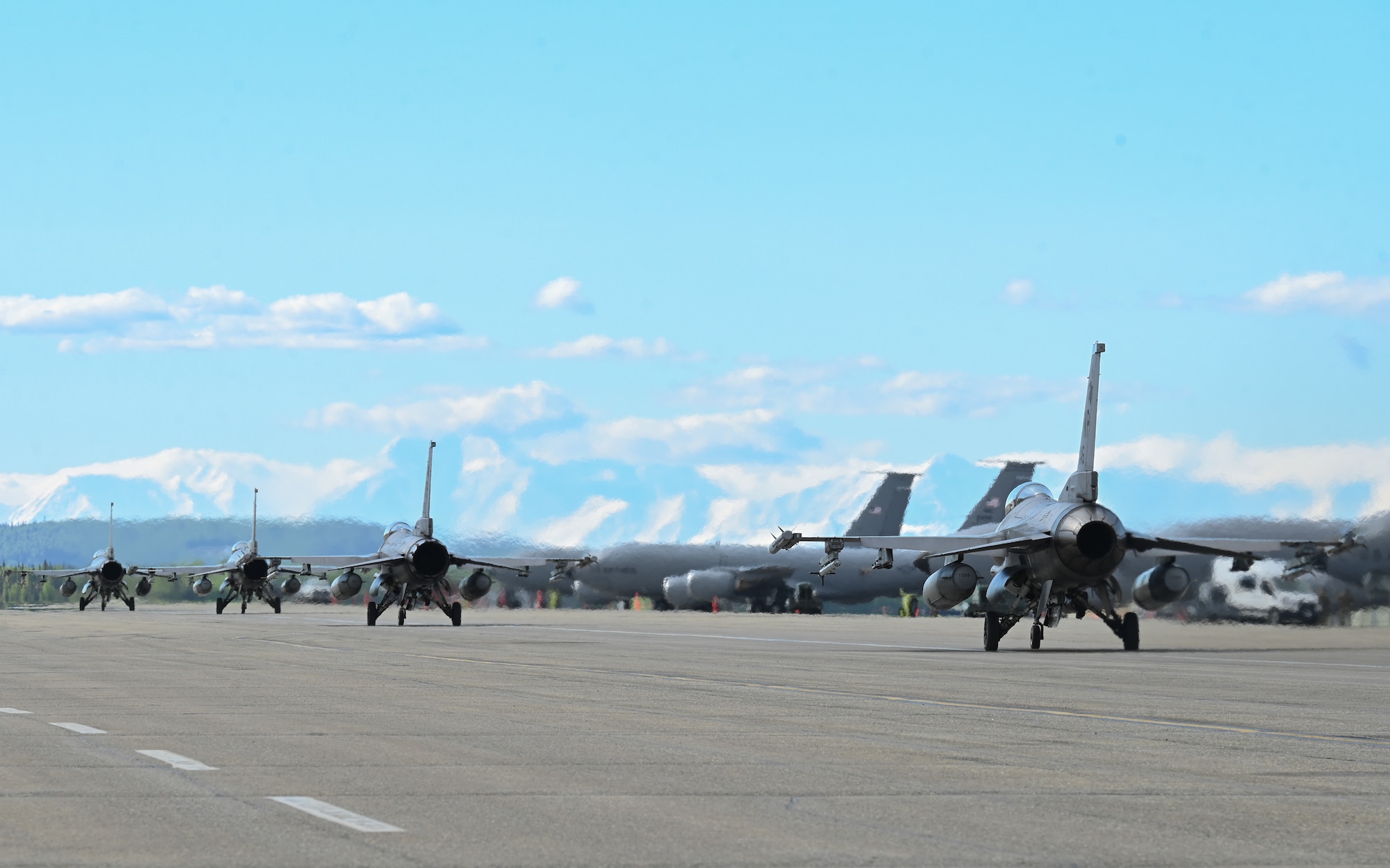 A team of U.S. Air Force F-16 Fighting Falcons, assigned to the 51st Fighter Wing from Osan Air Base, Republic of Korea, move down the flightline in preparation for a training sortie during RED FLAG Alaska 26-2 at Eielson Air Force Base, Alaska, June 1, 2026.