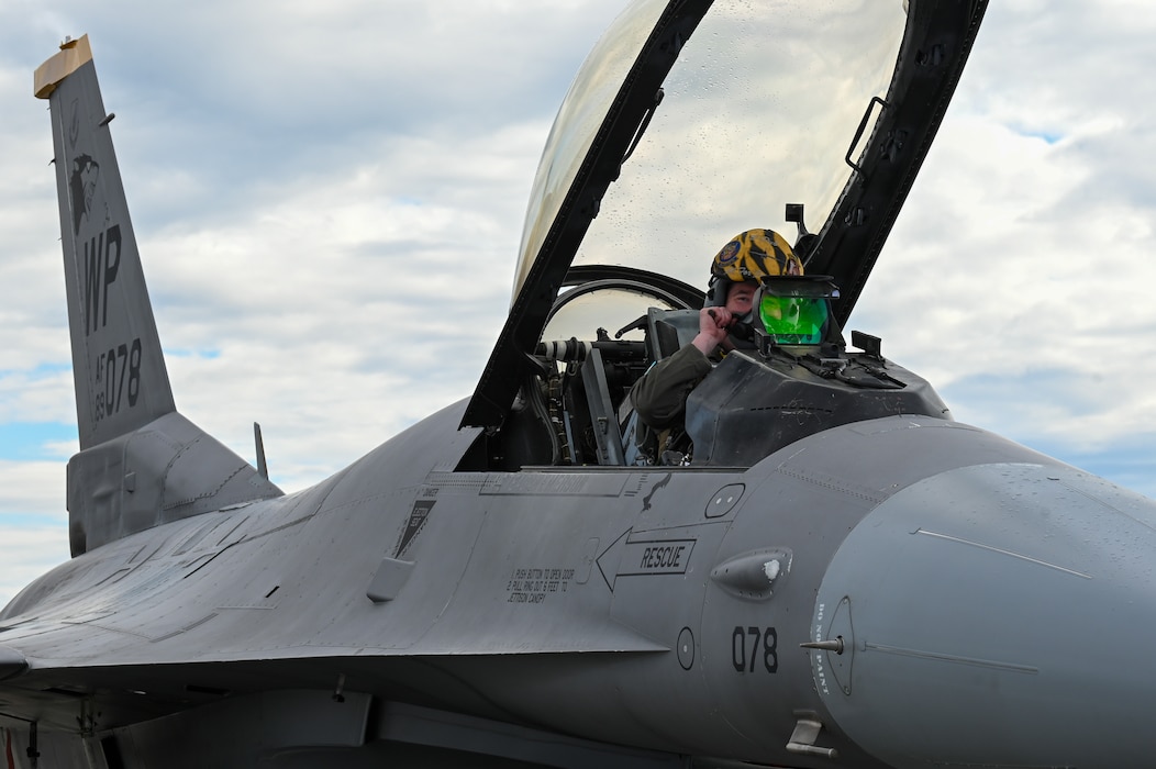 A U.S. Air Force pilot for the F-16 Fighting Falcon, assigned to the 51st Fighter Wing from Osan Air Base, Republic of Korea, gears up for a training sortie on the flightline at Eielson Air Force Base, Alaska, June 1, 2026.