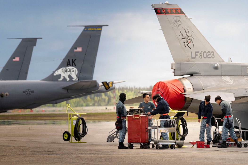 Republic of Singapore Air Force (RSAF) personnel conduct maintenance on an F-16 Fighting Falcon during Red Flag-Alaska 26-2 at Eielson Air Force Base, Alaska, May 28, 2026.