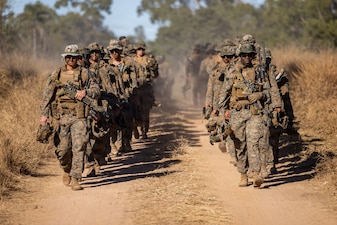 U.S. Marines with Alpha Company, 1st Battalion, 5th Marine Regiment, Marine Rotational Force – Darwin 26, walk to the opening ceremony of Exercise Southern Jackaroo in Townsville Field Training Area, Australia, May 29, 2026.