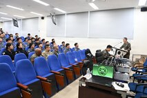 ROK and US military members sitting in an auditorium