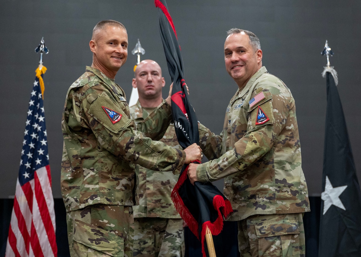U.S. Space Force Col. Dorian Hatcher, right, incoming U.S. Space Forces - Korea commander, accepts command of USSF-K from U.S. Space Force Brig. Gen. Brian Denaro, left, U.S. Space Forces Indo-Pacific commander, during a change of command ceremony at Osan Air Base, Republic of Korea, June 2, 2026. Hatcher’s career began on the Korean Peninsula 29 years ago as an Army private first class, where he developed an appreciation for readiness and the strength of the U.S.-ROK alliance. (U.S. Air Force photo by Staff Sgt. Sarah Williams)