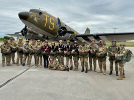 Jon Harmon (front) and members of the Liberty Jump Team pose in front of the C-49J Southern Cross in Corsicana, Texas, in April 2026. The team completed a basic and airborne refresher course to prepare for commemorative parachute jumps into Normandy, France, marking the 82nd anniversary of D-Day. (Contributed photo)