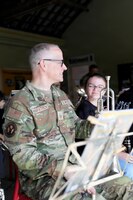 U.S. Air Force Master Sgt. Matthew Kirkpatrick, with the Five Star Brass, U.S. Air Forces in Europe, Air Forces Africa Band, prepares to play his trumpet with school children during a musical exchange at the Ecole Primaire Les Hauts Champs in Carentan-les-Marais, France, June 2, 2026. The exchange highlights our shared values of free cultural expression while building a connection between U.S. service members and a new generation in Normandy. From June 2-7, 2026, more than 600 U.S. Soldiers, Sailors, Marines, Guardians and Airmen from roughly 17 units historically linked to D-Day made up Joint Task Force 82 and participated in over 90 commemorative events throughout the Normandy Region. (U.S. Army National Guard photo by 1st Sgt. HollyAnn Nicom)