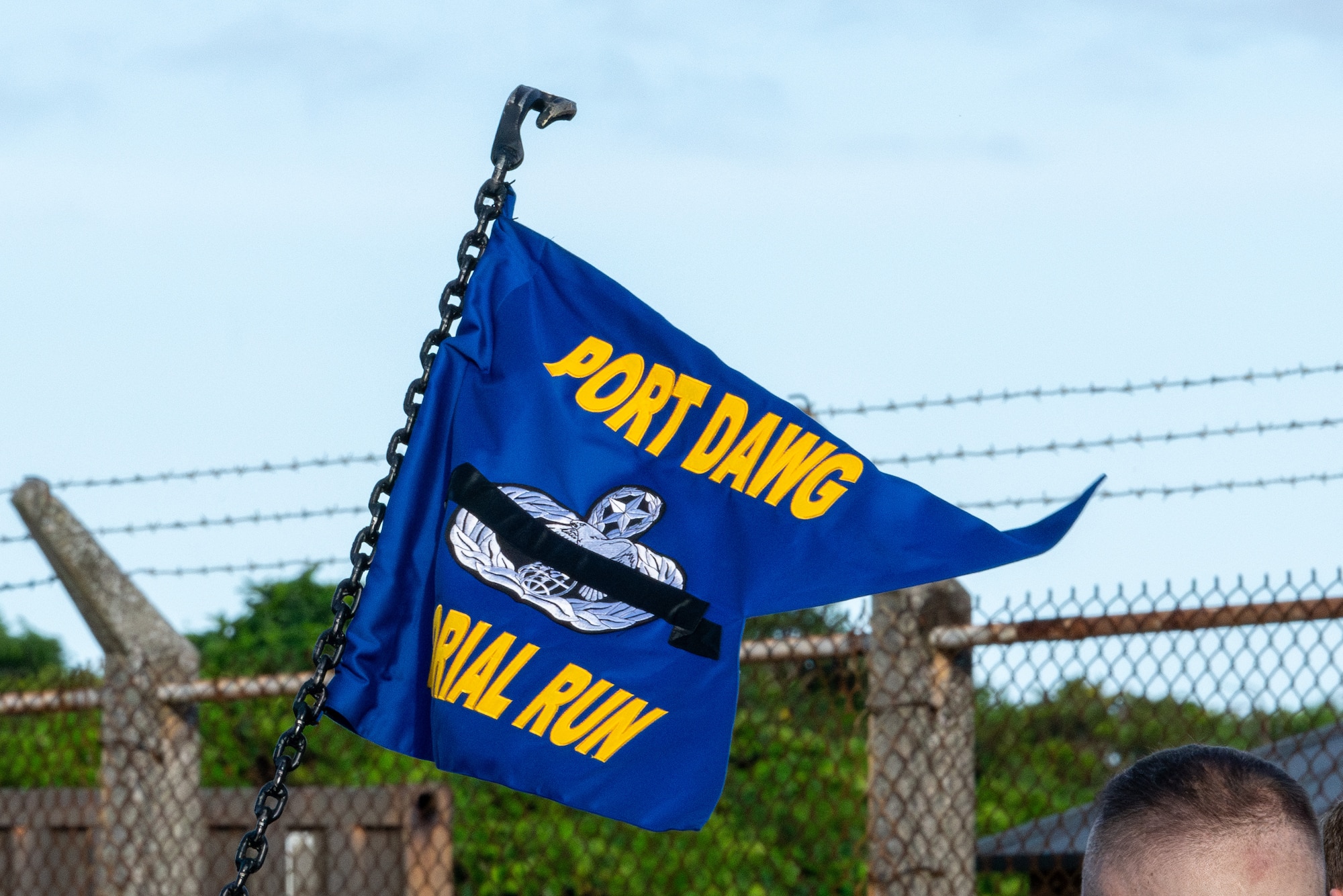 The AMS squadron flag flies in the wind