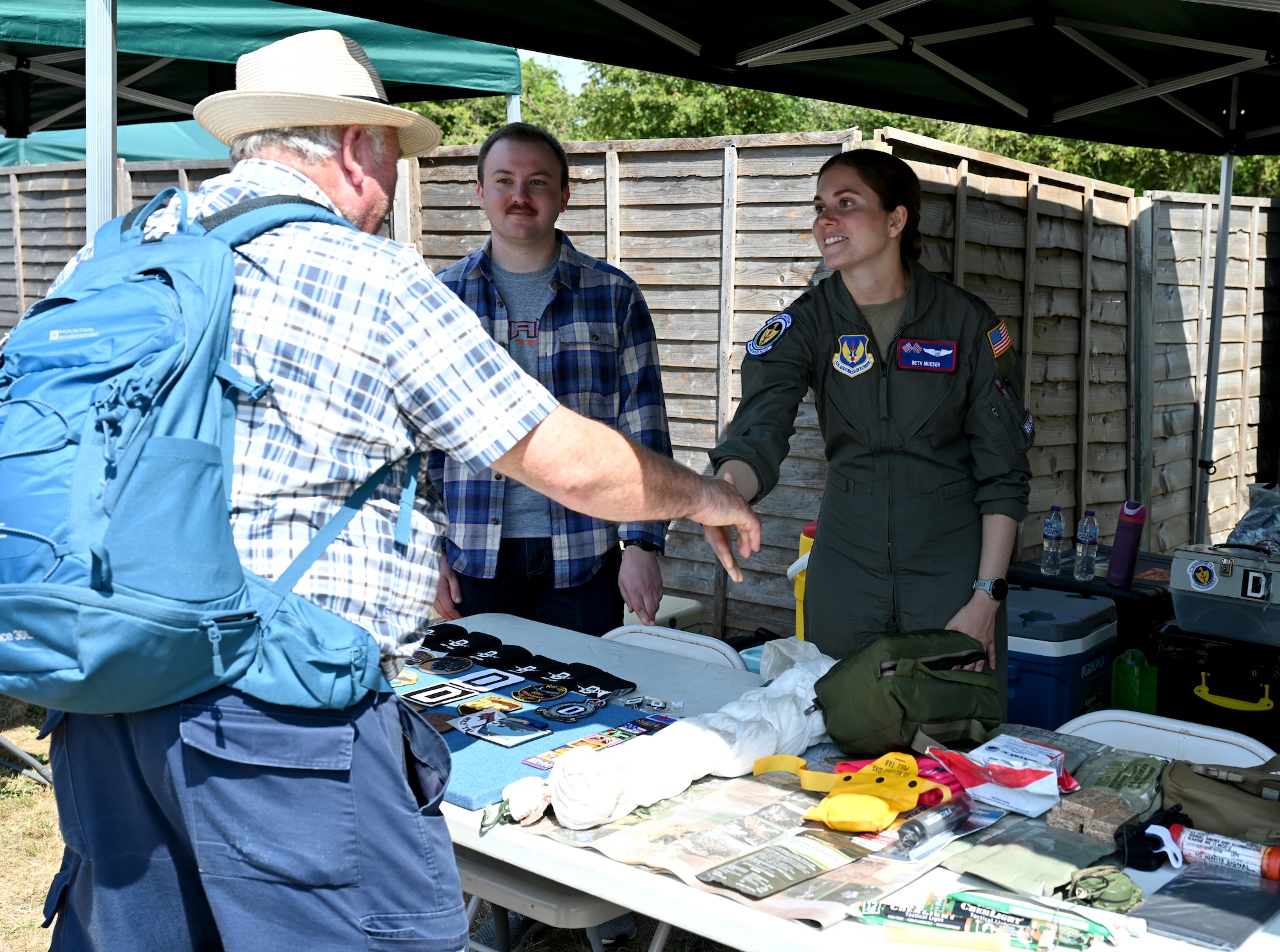 U.S. Air Force Capt. Beth Mueser, 351st Air Refueling Squadron KC-135 Stratotanker instructor pilot, chats with a member of the public at the Suffolk Show in Ipswich, England, May 27, 2026.  Airmen from RAF Mildenhall and RAF Lakenheath spent two days at the Suffolk Show showcasing their equipment and capabilities. The annual event celebrates Suffolk’s heritage, culture and industry and includes a range of displays and interaction by the U.S. Air Force, British military and cadets, and members of the local community. (U.S. Air Force photo by Karen Abeyasekere)