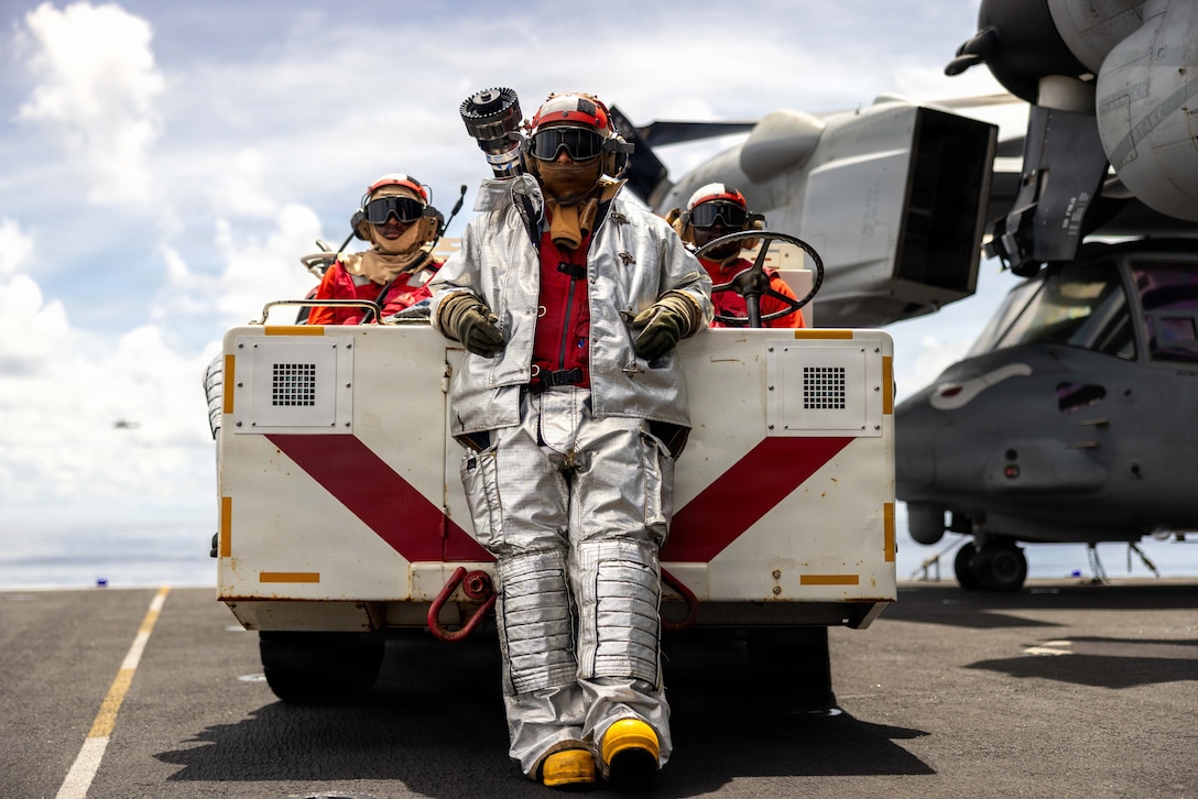 U.S. Navy Aviation Boatswain’s Mate 3rd Class Trevon Carter, left, Aviation Boatswain’s Mate Airman Dylan Tanguma, front, and Aviation Boatswain’s Mate 3rd Class Alseny Diallo, all assigned to Wasp-class amphibious assault ship USS Boxer (LHD 4), observe flight operations in the Indian Ocean, May 6, 2026. The 11th Marine Expeditionary Unit, embarked aboard the Boxer Amphibious Ready Group, is a persistent, combat credible force contributing to deterrence and crisis response in the U.S. 7th Fleet area of operations. U.S. 7th Fleet, the U.S. Navy's largest forward-deployed numbered fleet, routinely interacts and operates with allies and partners to preserve a free and open Indo-Pacific. (U.S. Marine Corps photo by Sgt. Trent A. Henry)