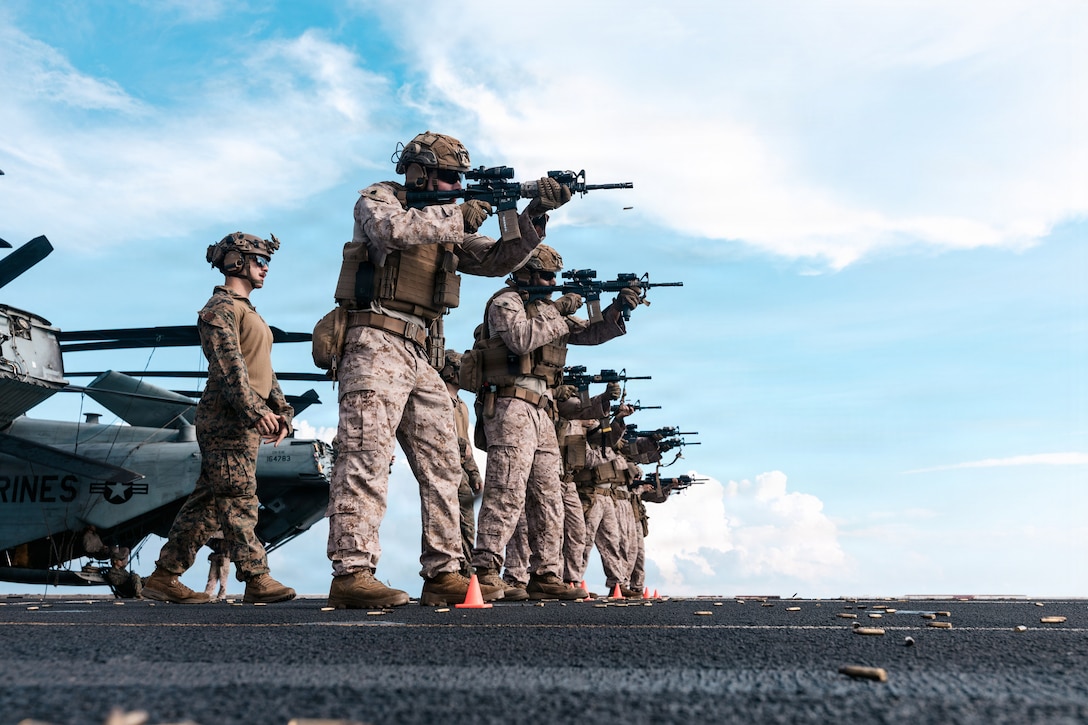 U.S. Marines with Combat Logistics Battalion 11, 11th Marine Expeditionary Unit, prepare to fire during marksmanship training on the flight deck of San Antonio-class amphibious transport dock ship USS Portland (LPD 27), May 15, 2026. The 11th MEU, embarked aboard the Boxer Amphibious Ready Group, is a persistent, combat credible force contributing to deterrence and crisis response in the U.S. 7th Fleet area of operations. U.S. 7th Fleet, the U.S. Navy’s largest forward-deployed numbered fleet, routinely interacts and operates with allies and partners to preserve a free and open Indo-Pacific. (U.S. Marine Corps photo by Lance Cpl. Luke Rodriguez)