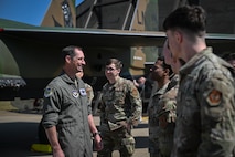 The commander chats with Airmen in front of the newly painted Operation El Dorado tailflash.