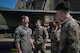 The commander chats with Airmen in front of the newly painted Operation El Dorado tailflash.