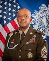 CSM McCall command photo with american flag and south carolina state flag in dress uniform