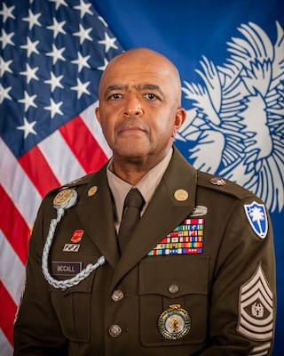 CSM McCall command photo with american flag and south carolina state flag in dress uniform