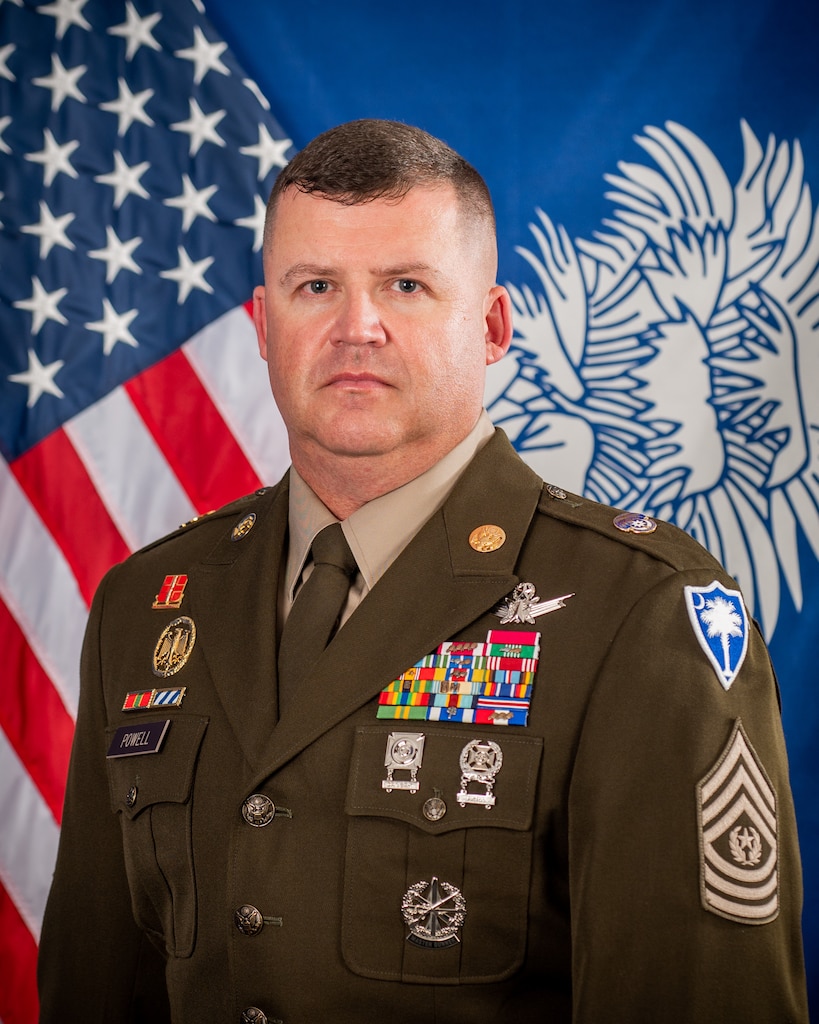 CSM Powell command photo in front of the american flag and south carolina state flag in dress uniform