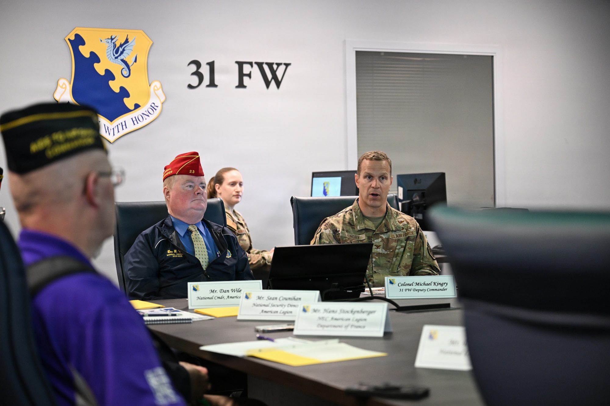 American Legion Commitee participate in a mission brief.