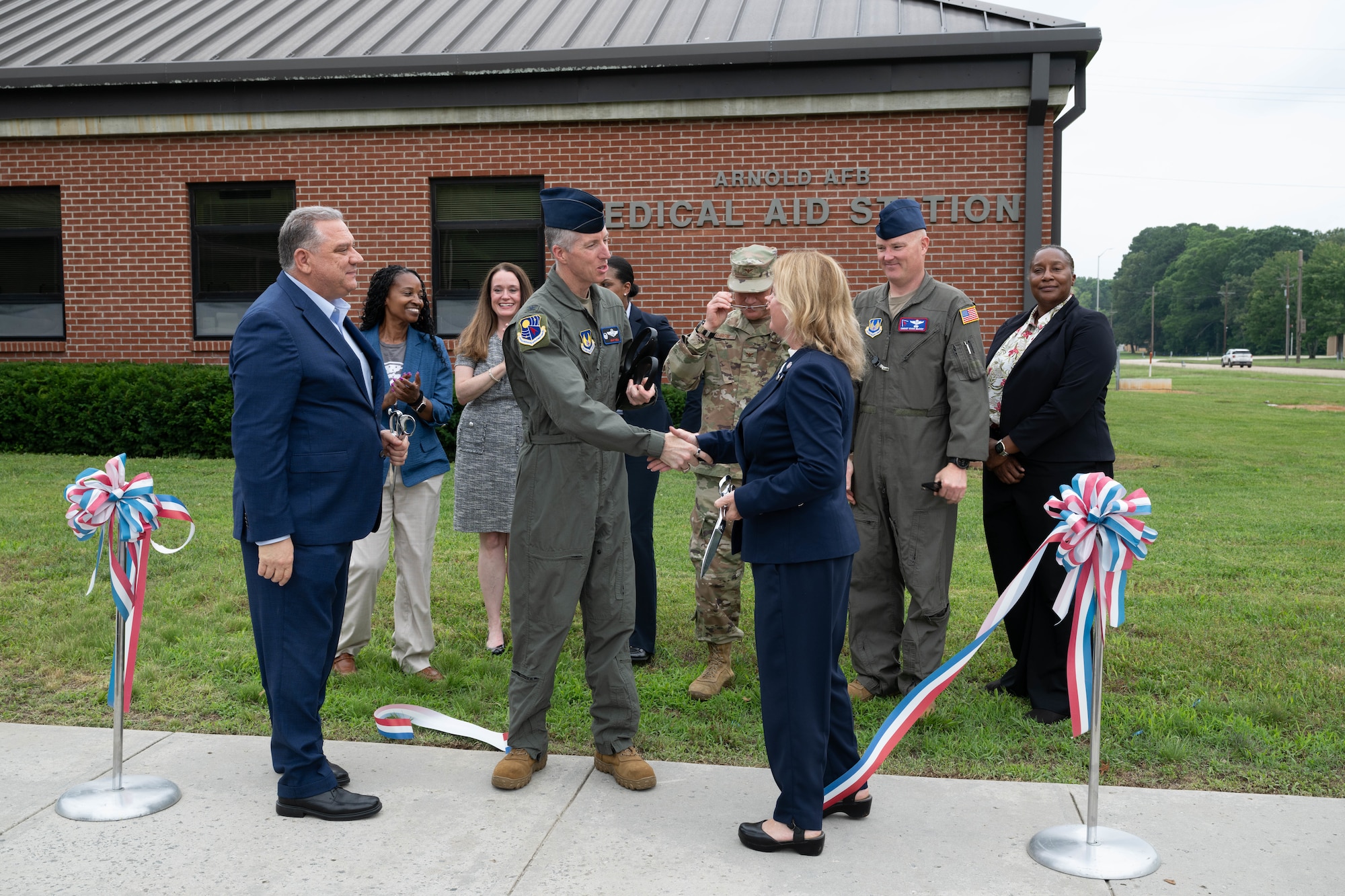 Veterans Affairs Tennessee Valley Healthcare System officials and Arnold Engineering Development Complex leadership cut the ribbon May 29, 2026, to celebrate the expansion of the Tullahoma VA Clinic at Arnold Air Force Base, Tenn. Prior to the expansion, the clinic served approximately 1,200 veterans. With the expansion, VA Tennessee Valley Healthcare System officials anticipate the clinic can serve an additional 1,800 eligible patients, including active duty Airmen. Pictured from left are Dr. Anthony Stazzone, VA MidSouth Health Care Network Interim Veteran Integrated Service Network 9 Director; Elizabeth Robinson, Chief Nurse of Primary Care; Dr. Nicole Salloum, Associate Chief of Staff of Primary Care; Col. Grant Mizell, AEDC Commander; Dr. Tija McDaniels; Primary Care Physician; Col. Eric Withrow, AEDC Test Support Division Chief; Dr. Bridget Brozyna, Interim Deputy Executive Director of VA Tennessee Valley Healthcare System; Chief Master Sgt. Evan McCoy, AEDC Senior Enlisted Leader; and Raina Rochon, Deputy Assistant Director of Patient Care Services. Arnold AFB is the headquarters of AEDC. (U.S. Air Force photo by Diamond Brown)