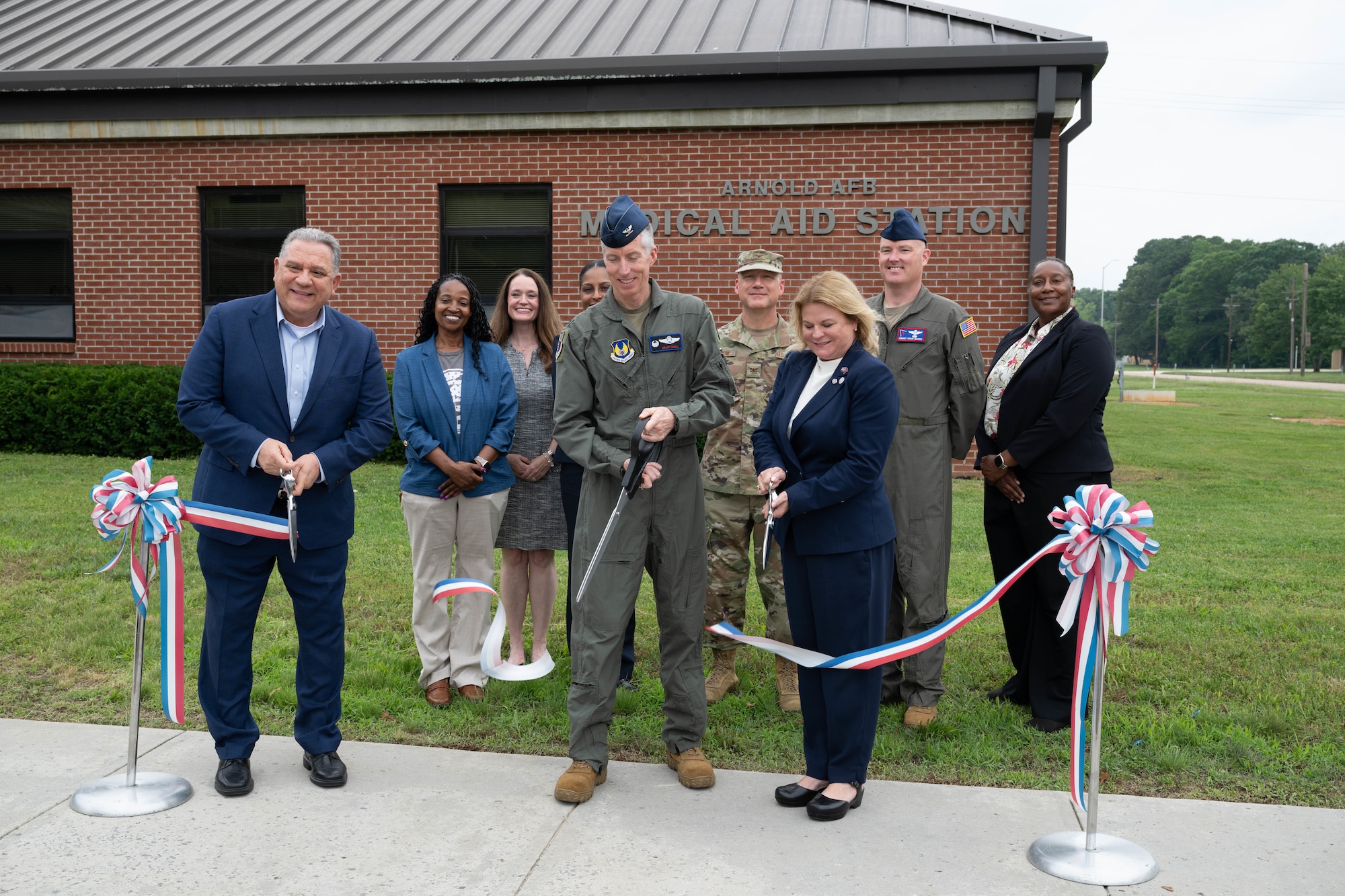 Veterans Affairs Tennessee Valley Healthcare System officials and Arnold Engineering Development Complex leadership cut the ribbon May 29, 2026, to celebrate the expansion of the Tullahoma VA Clinic at Arnold Air Force Base, Tenn. Prior to the expansion, the clinic served approximately 1,200 veterans. With the expansion, VA Tennessee Valley Healthcare System officials anticipate the clinic can serve an additional 1,800 eligible patients, including active duty Airmen. Pictured from left are Dr. Anthony Stazzone, VA MidSouth Health Care Network Interim Veteran Integrated Service Network 9 Director; Elizabeth Robinson, Chief Nurse of Primary Care; Dr. Nicole Salloum, Associate Chief of Staff of Primary Care; Dr. Tija McDaniels; Primary Care Physician; Col. Grant Mizell, AEDC Commander; Col. Eric Withrow, AEDC Test Support Division Chief; Dr. Bridget Brozyna, Interim Deputy Executive Director of VA Tennessee Valley Healthcare System; Chief Master Sgt. Evan McCoy, AEDC Senior Enlisted Leader; and Raina Rochon, Deputy Assistant Director of Patient Care Services. Arnold AFB is the headquarters of AEDC. (U.S. Air Force photo by Diamond Brown)