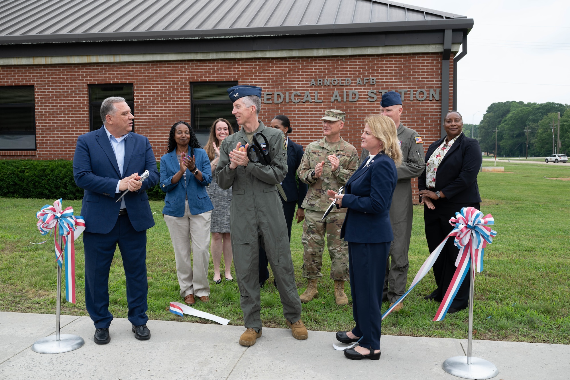 Veterans Affairs Tennessee Valley Healthcare System officials and Arnold Engineering Development Complex leadership cut the ribbon May 29, 2026, to celebrate the expansion of the Tullahoma VA Clinic at Arnold Air Force Base, Tenn. Prior to the expansion, the clinic served approximately 1,200 veterans. With the expansion, VA Tennessee Valley Healthcare System officials anticipate the clinic can serve an additional 1,800 eligible patients, including active duty Airmen. Pictured from left are Dr. Anthony Stazzone, VA MidSouth Health Care Network Interim Veteran Integrated Service Network 9 Director; Elizabeth Robinson, Chief Nurse of Primary Care; Dr. Nicole Salloum, Associate Chief of Staff of Primary Care; Col. Grant Mizell, AEDC Commander; Dr. Tija McDaniels; Primary Care Physician; Col. Eric Withrow, AEDC Test Support Division Chief; Dr. Bridget Brozyna, Interim Deputy Executive Director of VA Tennessee Valley Healthcare System; Chief Master Sgt. Evan McCoy, AEDC Senior Enlisted Leader; and Raina Rochon, Deputy Assistant Director of Patient Care Services. Arnold AFB is the headquarters of AEDC. (U.S. Air Force photo by Diamond Brown)