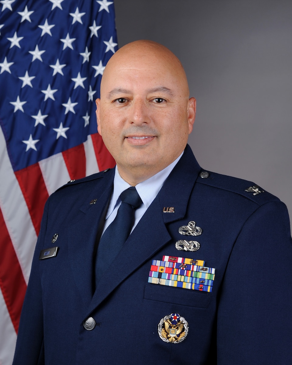 Ignacio Assaf in front of American flag