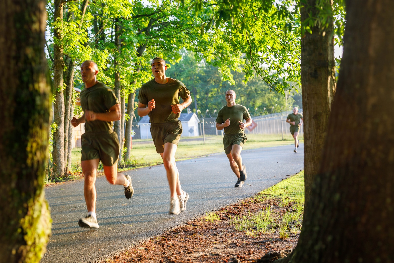 U.S. Marine Corps officer candidates with Officer Candidate School conduct a 3-mile run during an inventory physical fitness test on Marine Corps Base Quantico, Virginia, May 28, 2026. The Marine Corps Physical Fitness Test is composed of pull-ups or push-ups, planks, and a 3-mile run to test physical strength and endurance. The inventory PFT serves to evaluate and screen individuals for their leadership, moral, mental, and physical qualities required for commissioning as a U.S. Marine Corps Officer. (U.S. Marine Corps photo by Lance Cpl. Lynsee Avila-Ramirez)
