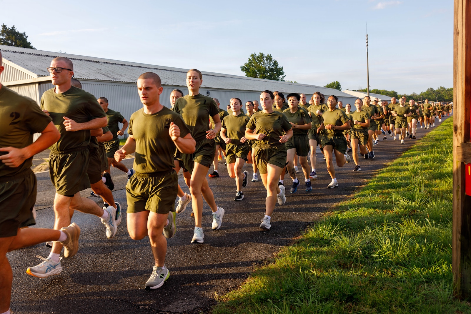 U.S. Marine Corps officer candidates with Officer Candidate School conduct a 3-mile run during an inventory physical fitness test on Marine Corps Base Quantico, Virginia, May 28, 2026. The Marine Corps Physical Fitness Test is composed of pull-ups or push-ups, planks, and a 3-mile run to test physical strength and endurance. The inventory PFT serves to evaluate and screen individuals for their leadership, moral, mental, and physical qualities required for commissioning as a U.S. Marine Corps Officer. (U.S. Marine Corps photo by Lance Cpl. Lynsee Avila-Ramirez)
