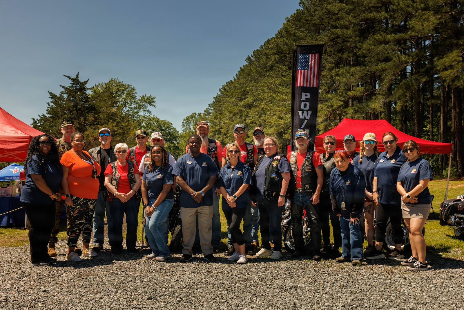 U.S. Marine Corps Sgt. Maj. Liam Williams, sergeant major of Marine Corps Base Quantico, poses for a photo with volunteers during the Exceptional Family Member Program Rolling into Summer event at Lunga Park on MCB Quantico, Virginia, May 30, 2026. Rolling into Summer is an event held with community partners with a focus on fun, safety, and community. During the event, families enjoyed crafts, sports relays, and opportunities to learn about base resources while building their local network and speaking with base leadership and EFMP Family Caseworkers. (U.S. Marine Corps photo by Cpl. Harleigh Faulk)
