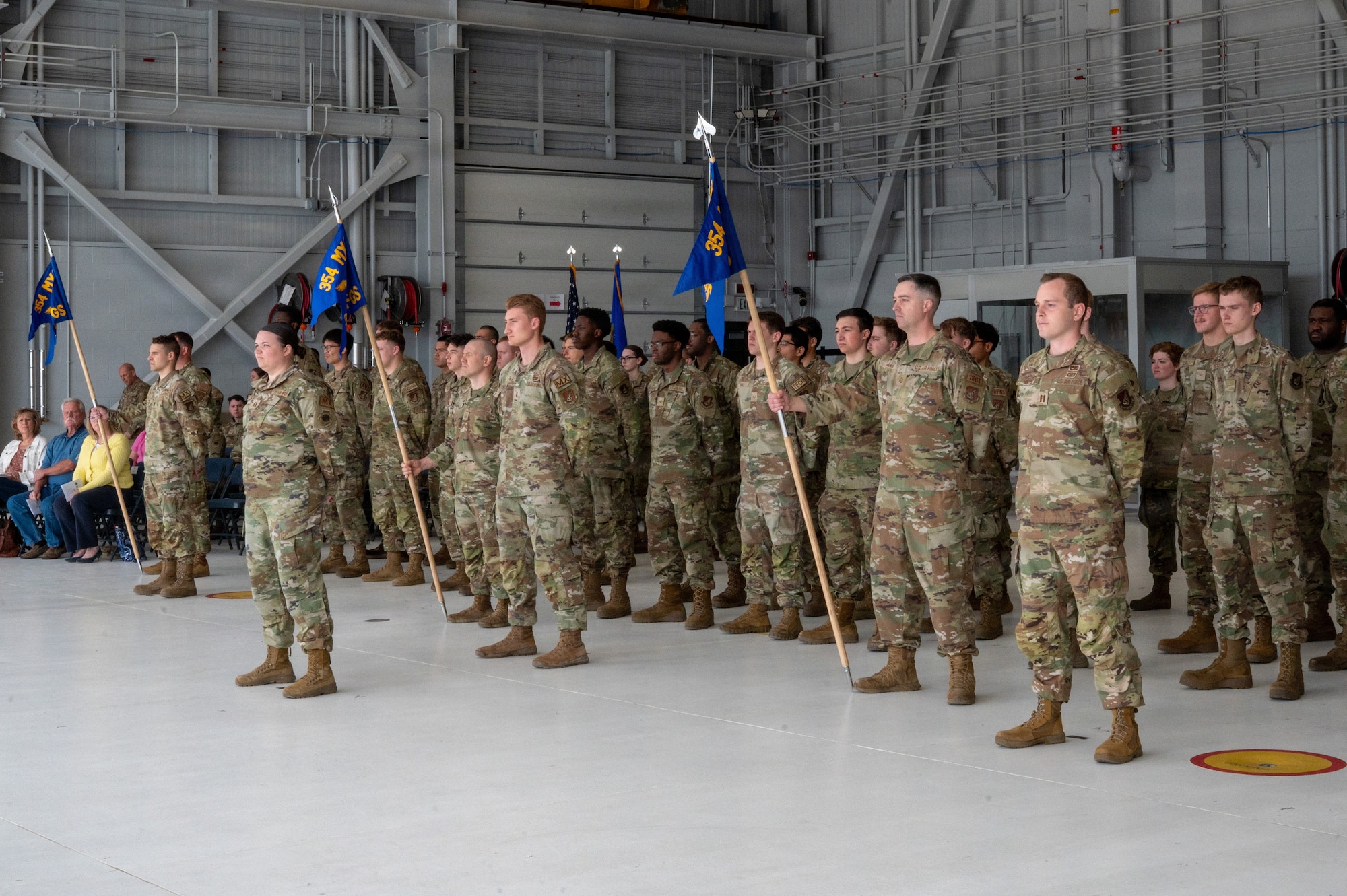 Airmen assigned to the 355th, 356th and 18th Fighter Generation Squadrons stand in formation during the 354th Aircraft Maintenance Squadron reactivation ceremony at Eielson Air Force Base, Alaska, June 1, 2026. The reorganization back to an AMXS aligns with the Air Force’s continued focus on strengthening readiness, streamlining maintenance operations and enhancing combat capability across the wing. (U.S. Air Force photo by Airman First Class Lara Jhane Rabago)