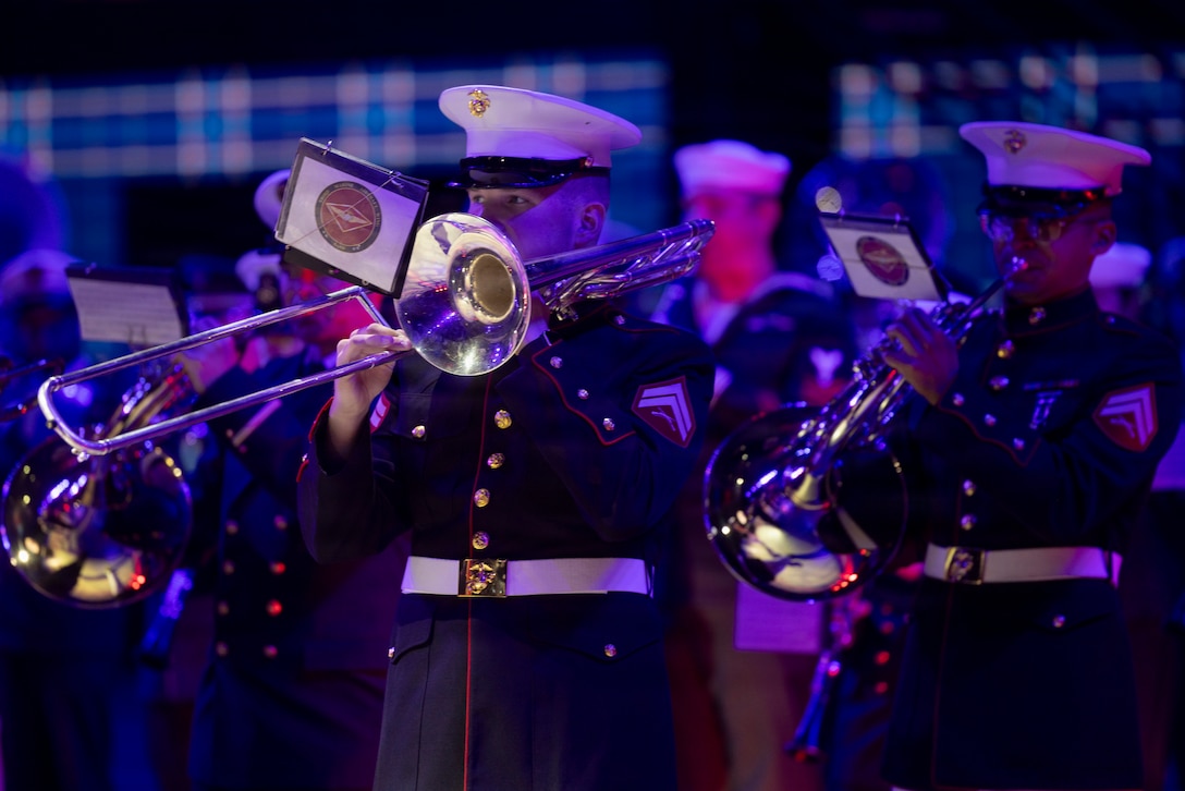 U.S. Marine Corps Cpl. Jacob Doll, a trombone instrumentalist with 3rd Marine Aircraft Wing Band, perform for the opening of the Virginia International Tattoo in Norfolk, Virginia, April 17, 2026. The Virginia International Tattoo is an annual event consisting of performances from military bands, drill teams, dancers and singers from around the world. The event celebrated the alliances between the U.S., the U.K., Canada, France, and South Korea. (U.S. Marine Corps photo by Lance Cpl. Zoey Williams)