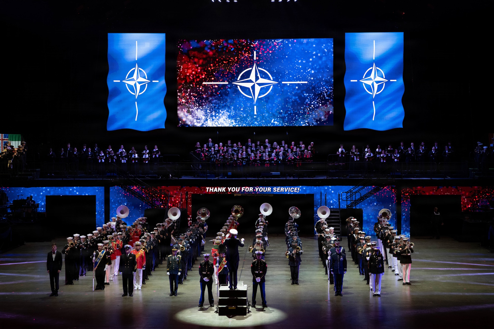 An ensemble band made up of members of different performance elements perform the NATO anthem during the Virginia International Tattoo at Scope Arena in Norfolk, Virginia, April 18, 2026. The annual event showcases military bands and ceremonial units from around the world, highlighting tradition, precision and international partnership. (U.S. Army photos by Sgt. Samantha Cate)