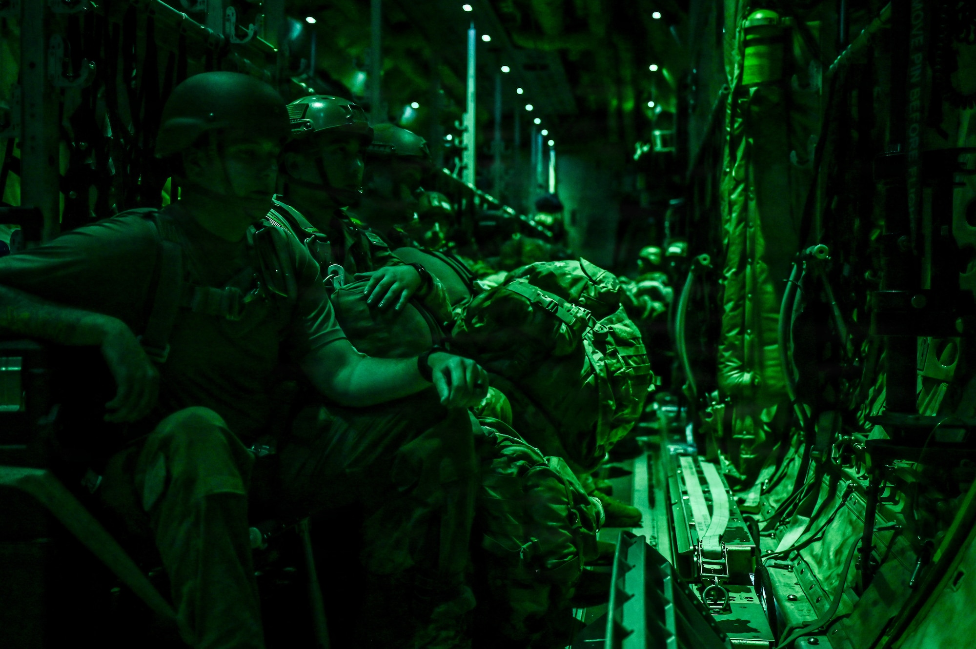 Soldiers from the 1st Battalion 509th Infantry Regiment prepare to conduct a nighttime static-line airdrop operation from a C-130J Super Hercules on May 11, 2026, during STORM FLAG 26-07 in Gulfport, Mississippi. The exercise involved both air and ground forces working together to achieve combat mission objectives. (U.S. Air Force photo by Senior Airman Isabella Ortega)