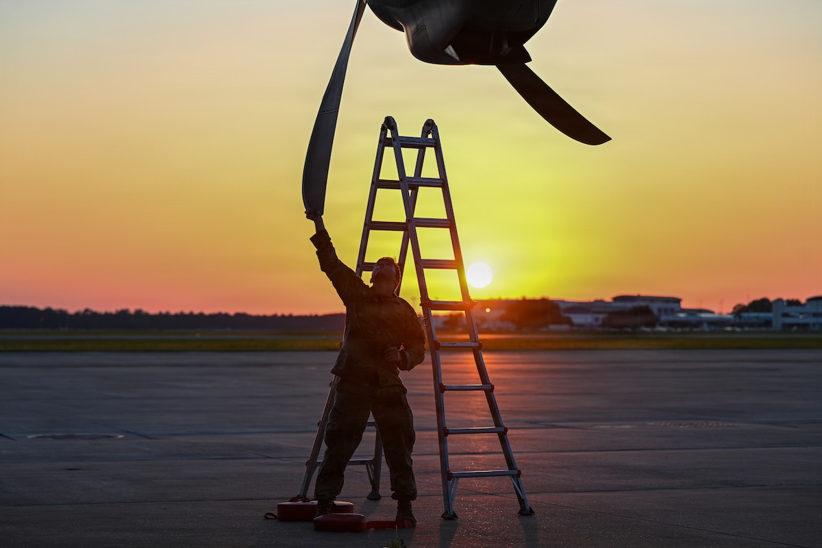 A maintainer from the 317th Aircraft Maintenance Squadron checks the props on a C-130J Super Hercules assigned to the 39th Airlift Squadron from Dyess Air Force Base, Texas, on May 13, 2026, at the Combat Readiness Training Center in Gulfport, Mississippi. Maintainers conducted around-the-clock operations to ensure aircraft were ready to meet the requirement outlined in the simulated air tasking order. (U.S. Air Force photo by Senior Airman Isabella Ortega)