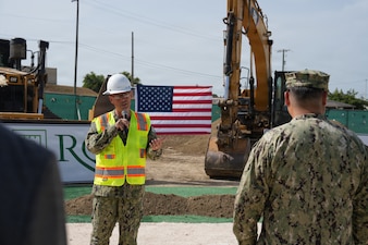 GUANTANAMO BAY, Cuba (June 2, 2026) – Rear Adm. Robert Hawkins, director of Defense Health Network Atlantic and commander of Naval Medical Forces Atlantic, addresses installation leadership, contracting representatives, and project stakeholders during a groundbreaking ceremony for the construction of a new ambulatory care center aboard Naval Station Guantánamo Bay, Cuba, June 2, 2026. The new 90,600-square-foot facility will replace the existing hospital, which has been in service since 1956. (Official U.S. Navy photo by Emily McCamy)