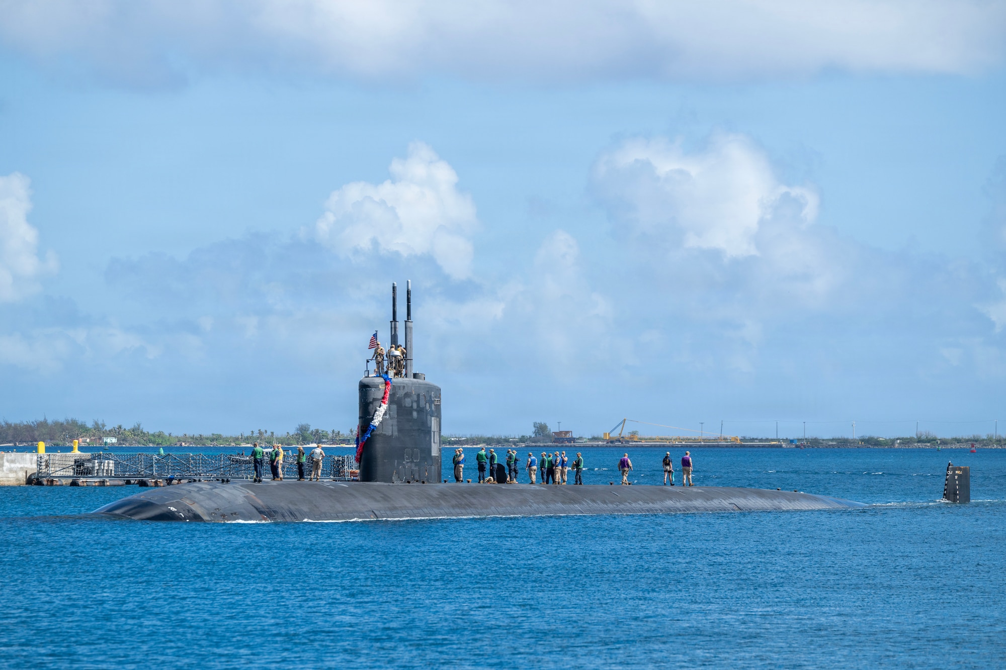 NAVAL BASE GUAM (May 31, 2026) – Los Angeles-class fast-attack submarine USS Springfield (SSN 761) transits Apra Harbor at Naval Base Guam, returning to its homeport after completing a routine deployment in the Indo-Pacific, May 31, 2026. Assigned to Commander, Submarine Squadron 15, based at Polaris Point, Naval Base Guam, Springfield is one of five forward-deployed fast-attack submarines. Renowned for their unparalleled speed, endurance, stealth, and mobility, fast-attack submarines are the backbone of the Navy’s submarine force. Regarded as apex predators of the sea, Guam’s fast-attack submarines serve at the tip of the spear, helping to reaffirm the submarine force's forward-deployed presence in support of a free and open Indo-Pacific. (U.S. Navy photo by Mass Communication Specialist 1st Class Bryan Mai)