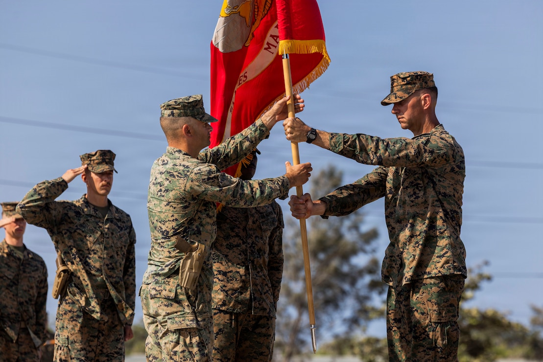 From left, U.S. Marine Corps Lt. Col. Robert Wallace, the incoming battalion commander, and Lt. Col. Timothy Love, the outgoing battalion commander, both assigned to 3rd Littoral Combat Team, 3rd Marine Littoral Regiment, 3rd Marine Division, exchange the unit colors during the 3rd LCT change of command ceremony at Camp Cape Bojeador, Philippines, May 18, 2026. The ceremony formally transferred authority and responsibility from the outgoing commander to the incoming commander while reinforcing the unit’s continued support to bilateral training and interoperability alongside Philippine allies and partners. Wallace is from Michigan and Love is from Maryland. (U.S. Marine Corps photo by Sgt. Iyer Ramakrishna)