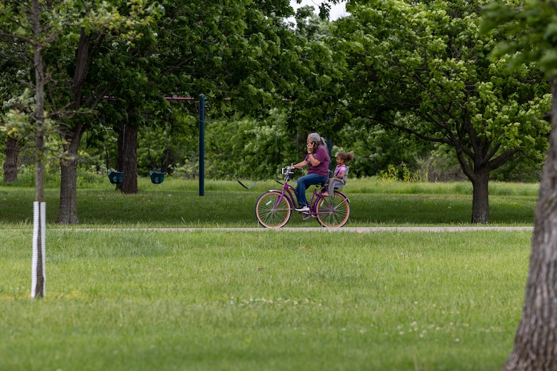 Family riding bike trail