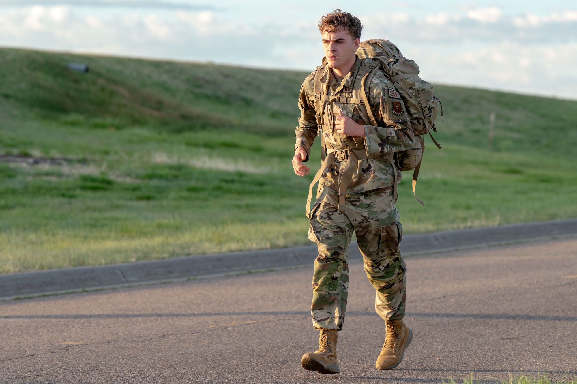 U.S. Air Force Defender runs during a ruck for National Police Week 2026.
