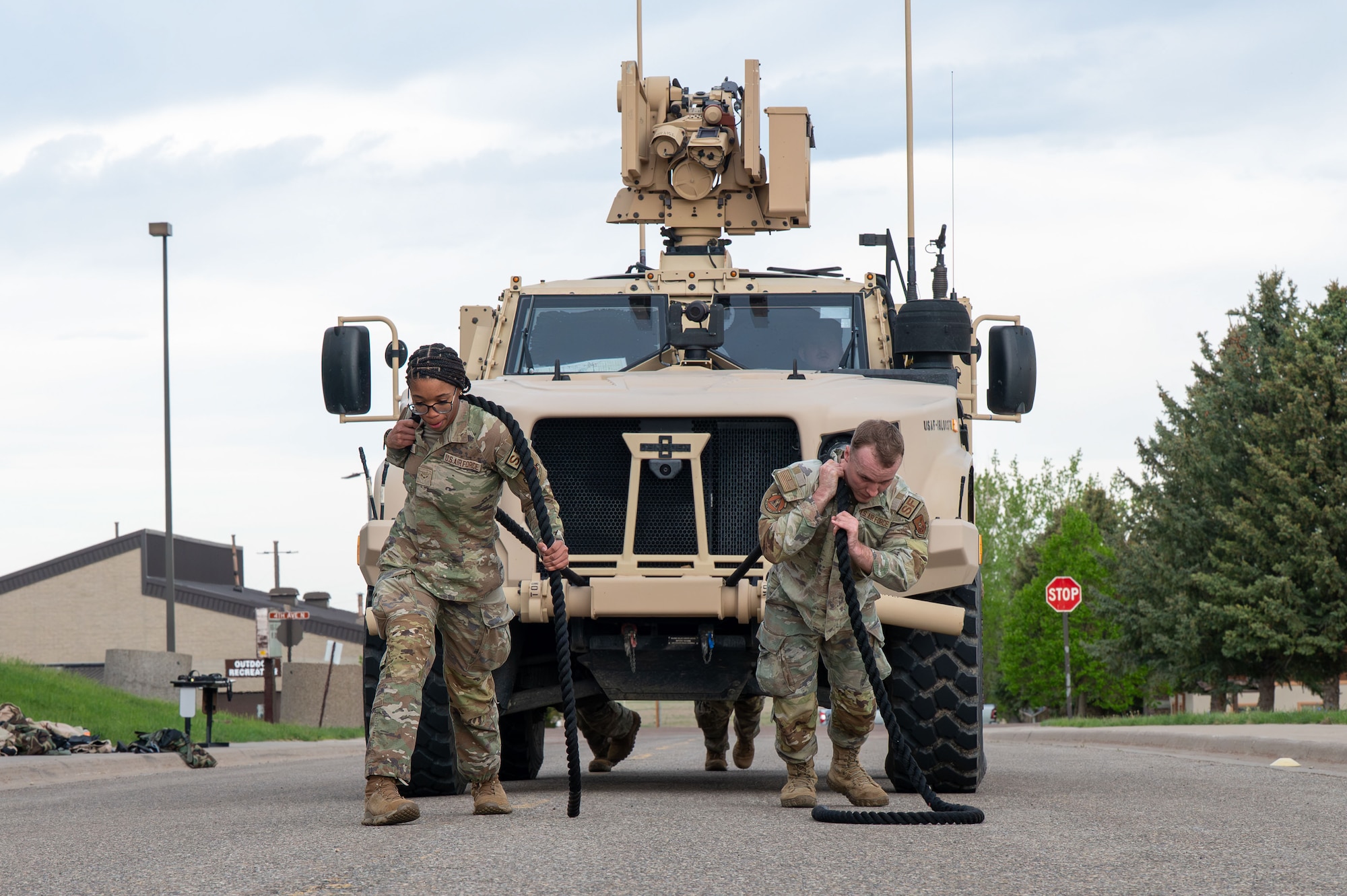 Defenders pull an Air Force JLTV truck