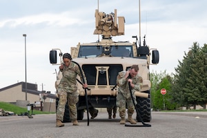 Defenders pull an Air Force JLTV truck