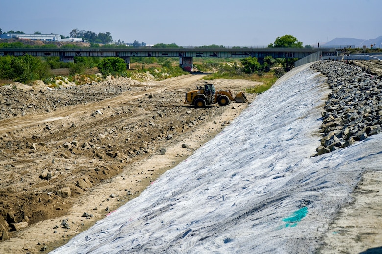 The left levee in the U.S. Army Corps of Engineers-led Riverside Levees Rehabilitation Project, still in progress in this photo, is visible May 8 in Riverside, California.