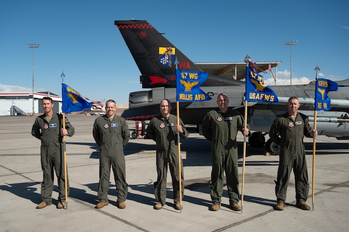 From left to right, U.S. Air Force Brig. Gen. David C. Epperson, U.S. Air Force Warfare Center commander, Brig. Gen. Kristoff R. Smith, USAFWC deputy commander, Brig. Gen. Lawrence T. Sullivan, 57th Wing commander, Col. David T. Madson, USAF Weapons School commandant, and Lt. Col. Anthony R. Norman, 16th Weapons Squadron commander, pose for a group photo.
