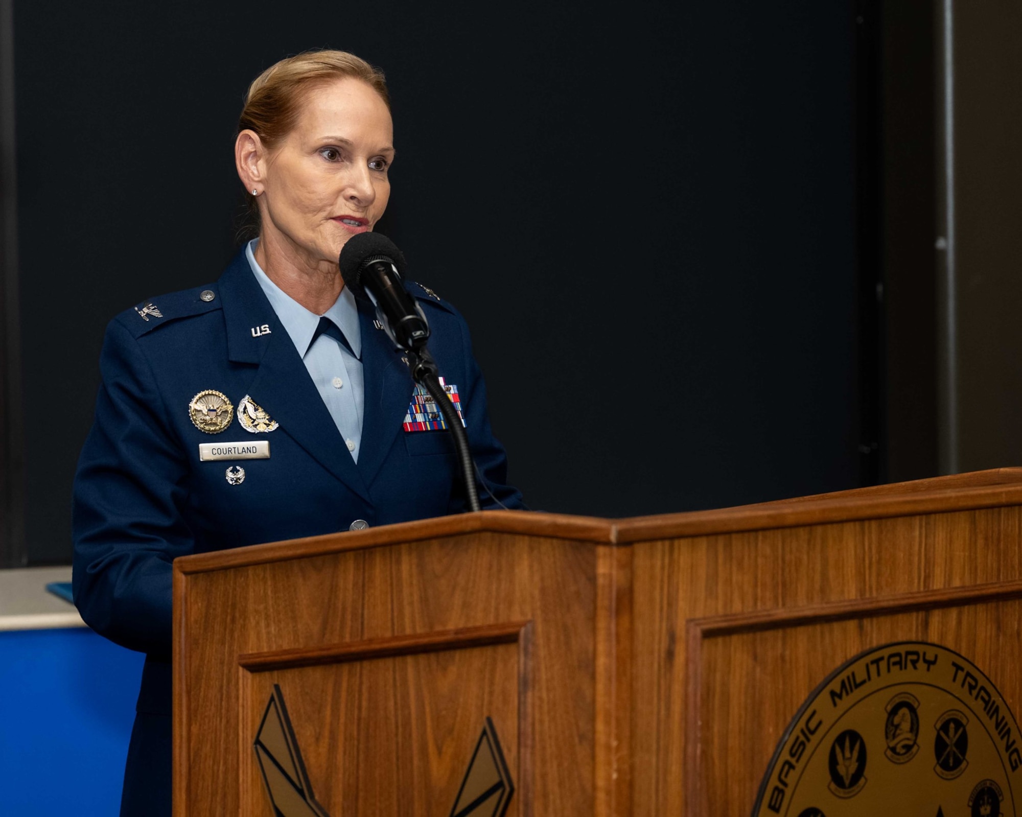 U.S. Air Force Col. Kellie S. Courtland, 37th Training Wing incoming commander, shares remarks during the 37th TRW change of command ceremony at Joint Base San Antonio-Lackland, Texas, May 29, 2026. The change of command ceremony is a military tradition that allows unit members to see the outgoing commander depart and identify the incoming commander. (U.S. Air Force photo by Marcus Robins)