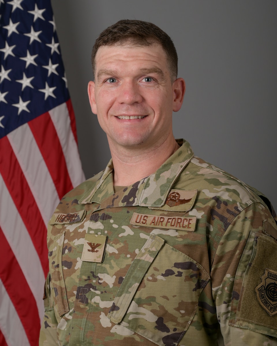 Head and shoulders photo of Col. Hershey with an American Flag in the background