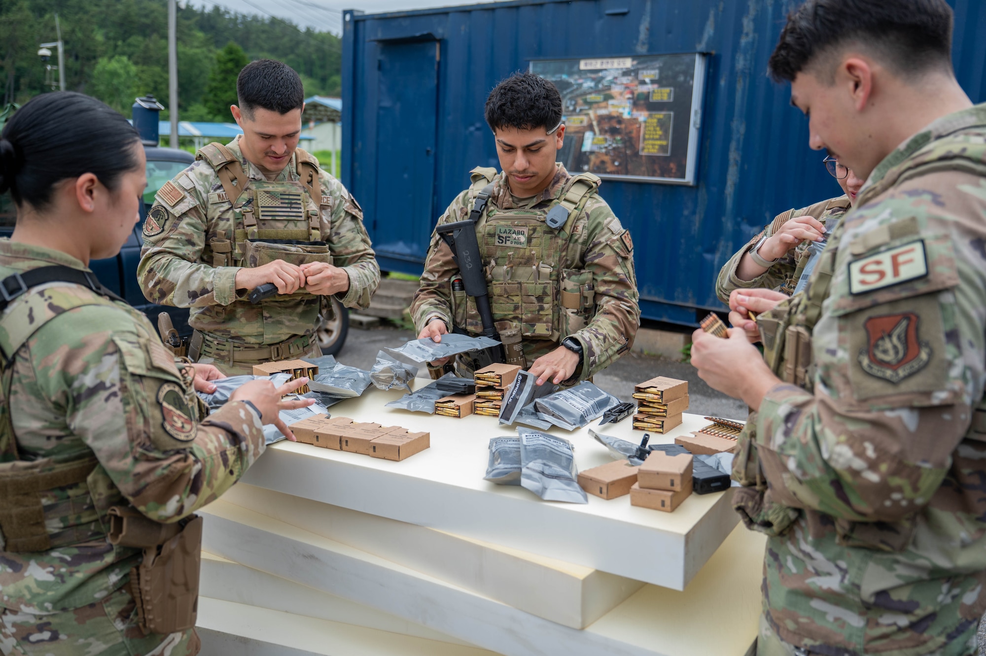 Members of the 8th Security Forces Squadron begin loading ammunition in magazines before the defender weapon trainer class at a Republic of Korea Army shooting range, Republic of Korea, May 27, 2026. The training supported Kunsan’s inaugural defender weapon trainer course, which aims to integrate nonspecialized personnel into training roles. (U.S. Air Force photo by Staff Sgt. Cedrique Oldaker)